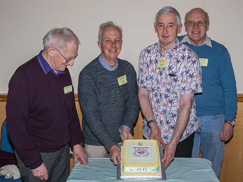 The BCSS officials and speakers with the anniversary cake